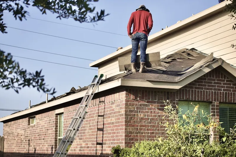 Professional roofer working on a residential roof in Johnson City